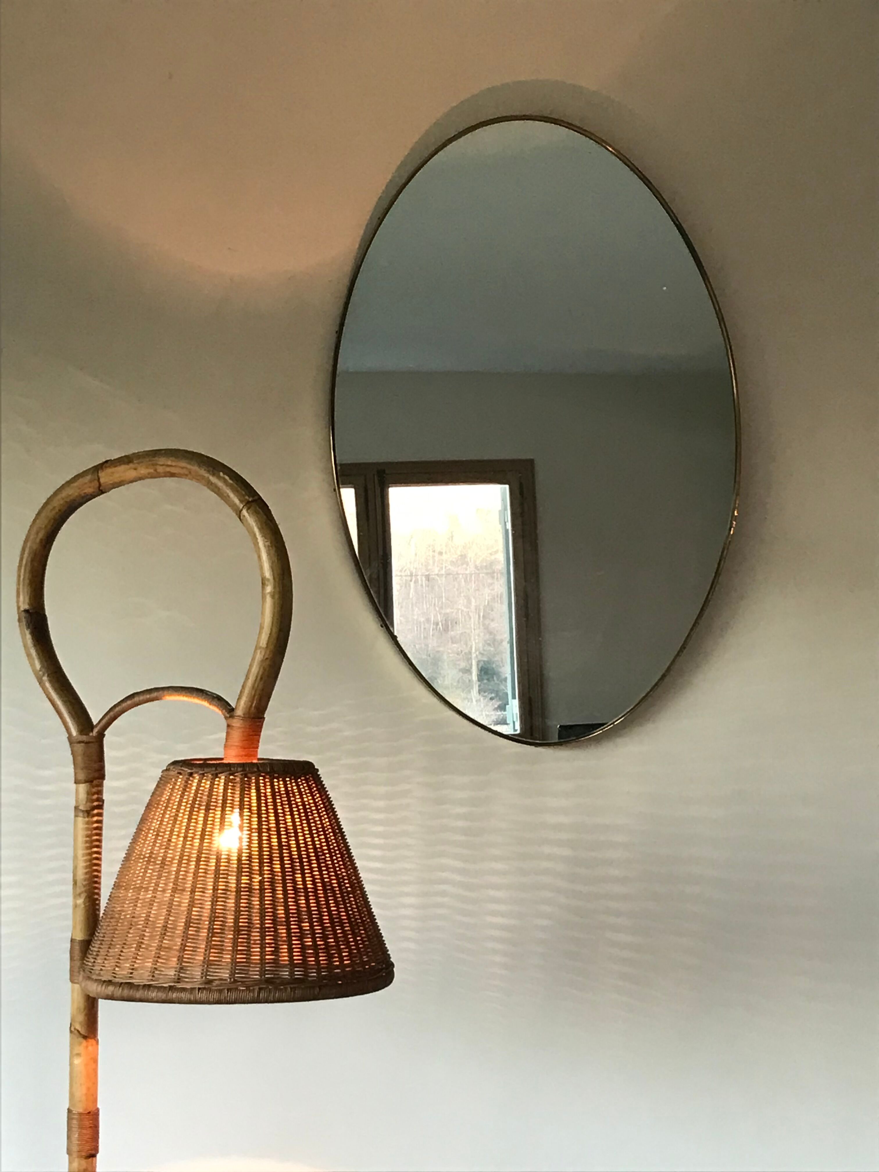 Oval brass mirror, Italy, circa 1960.