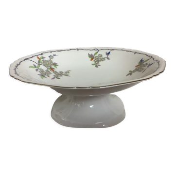 Old footed dish with gypsophila, white flowers.