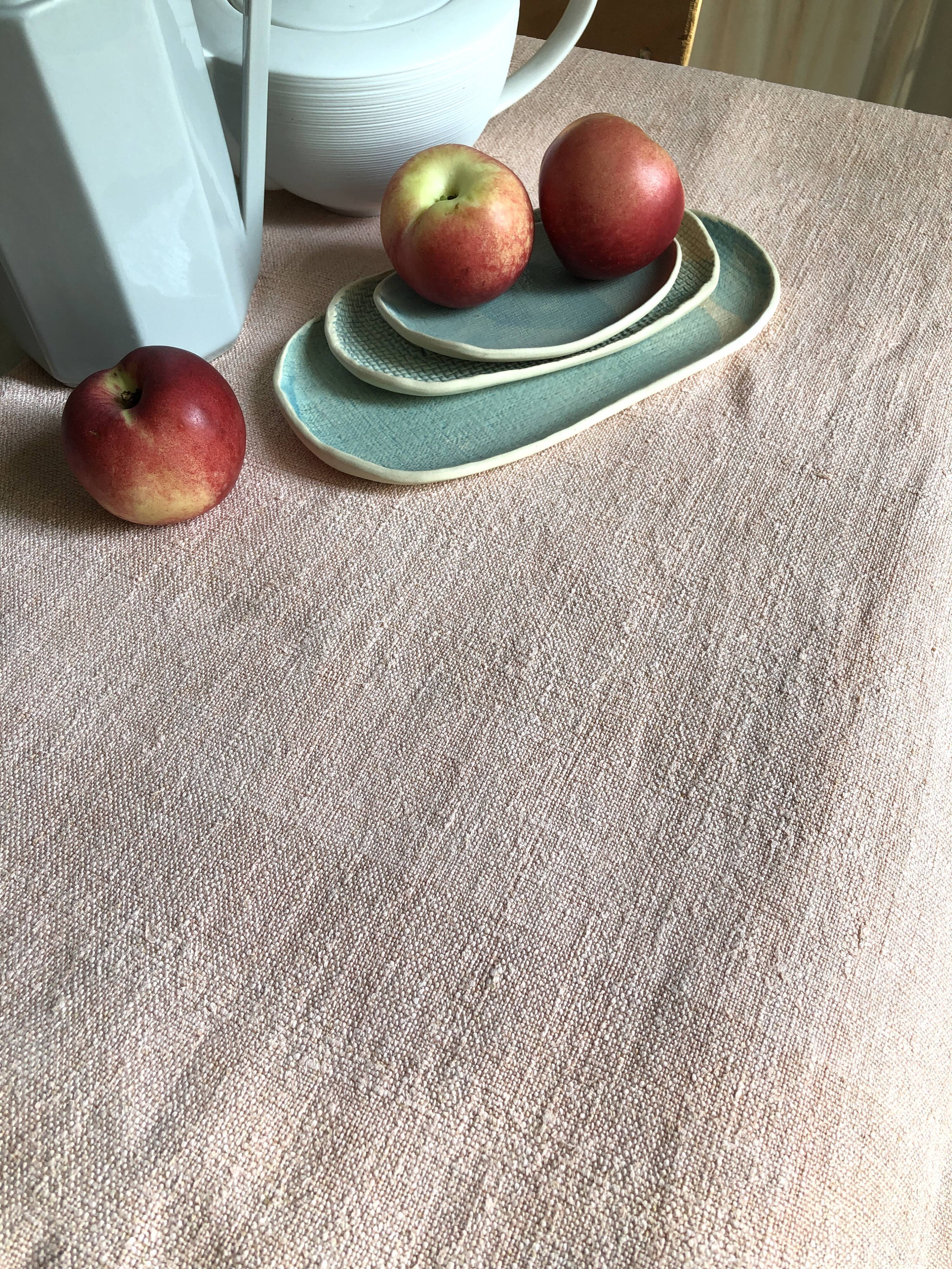Old hemp harvest tablecloth tinted in pink tea