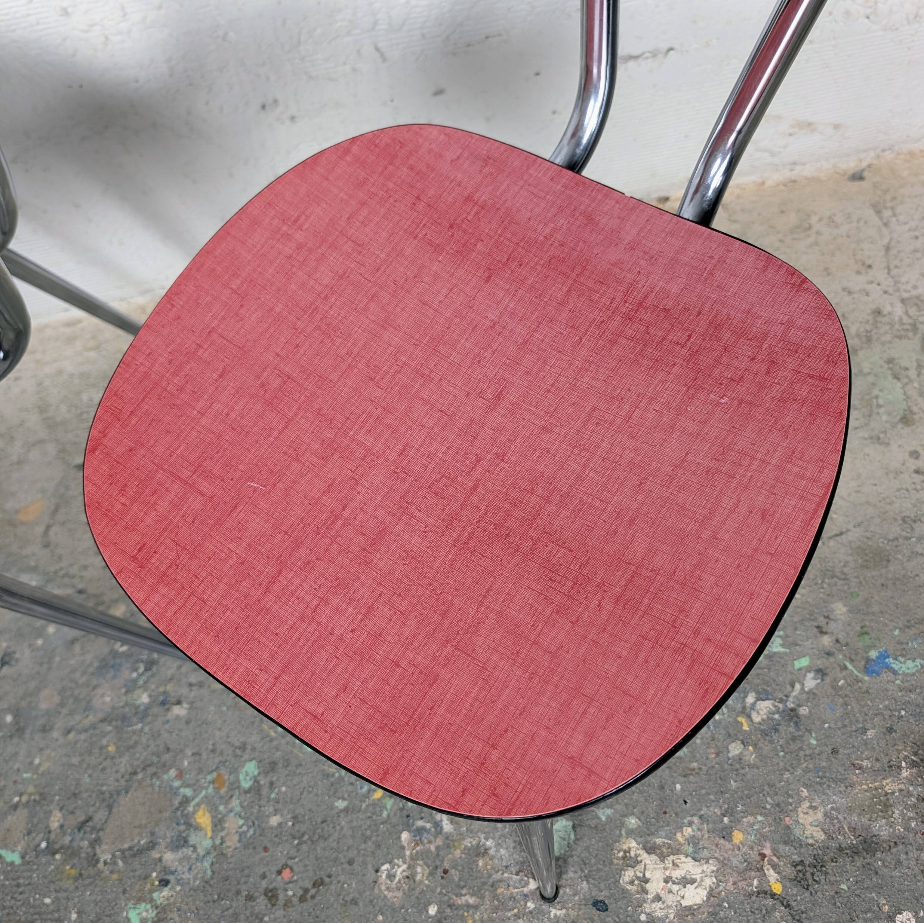 Pair of red Formica chairs with chrome legs