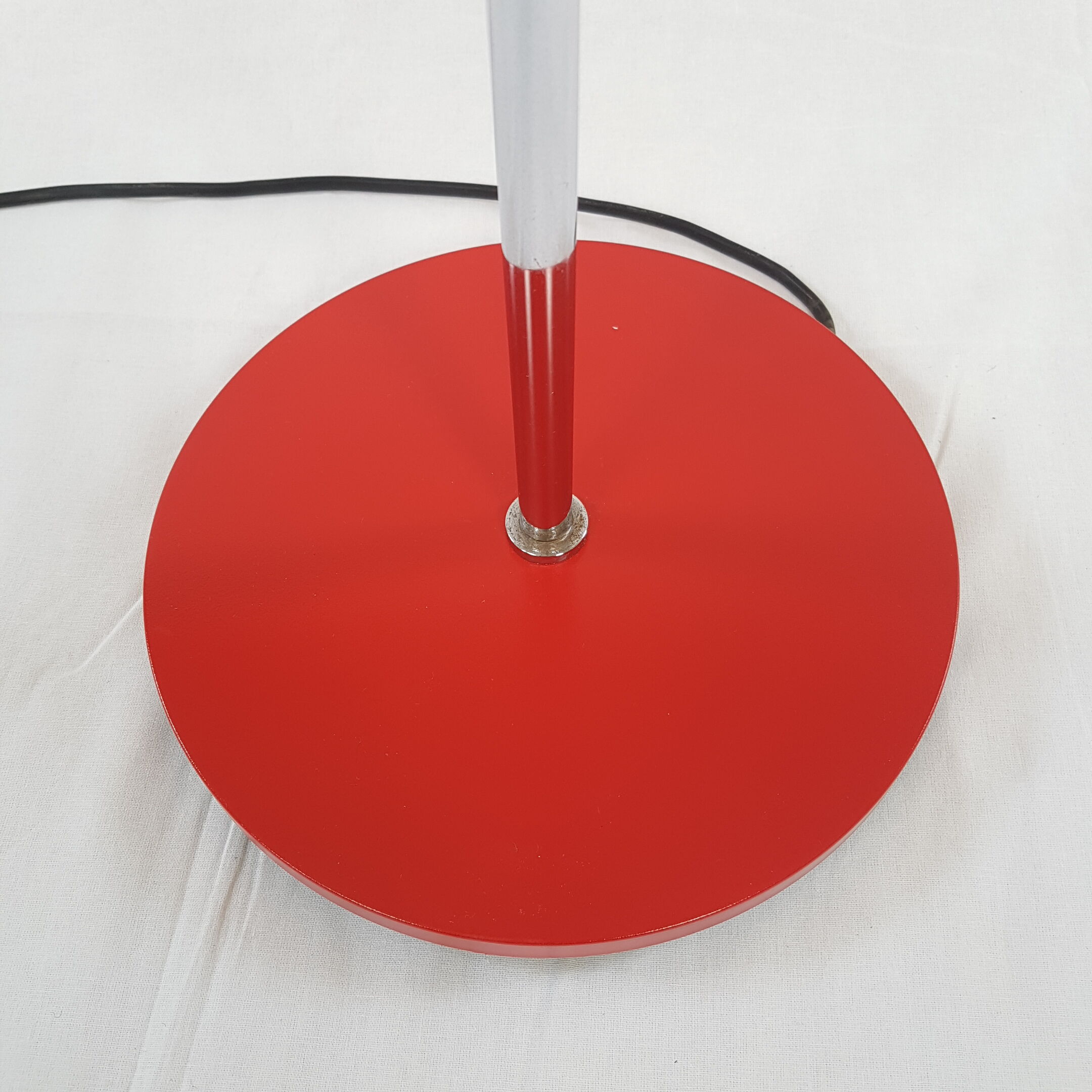 Two red lights and chrome floor lamp
