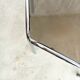 Vintage hexagonal table with smoked glass top and chrome metal structure.