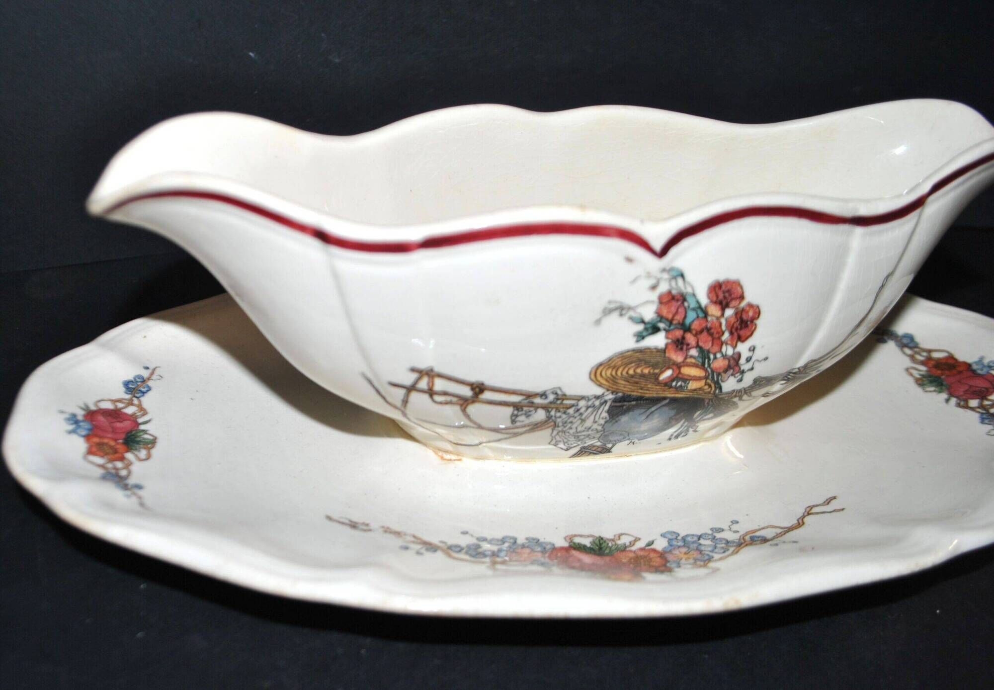 Sarreguemines sauce boat and dish in earthenware with "Obernai" decoration by Henri Loux