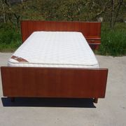Vintage bed in teak with integrated bedside table.