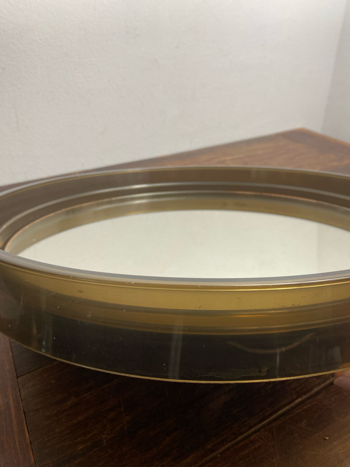 Circular mirror, smoked plastic, 1960s/70s.