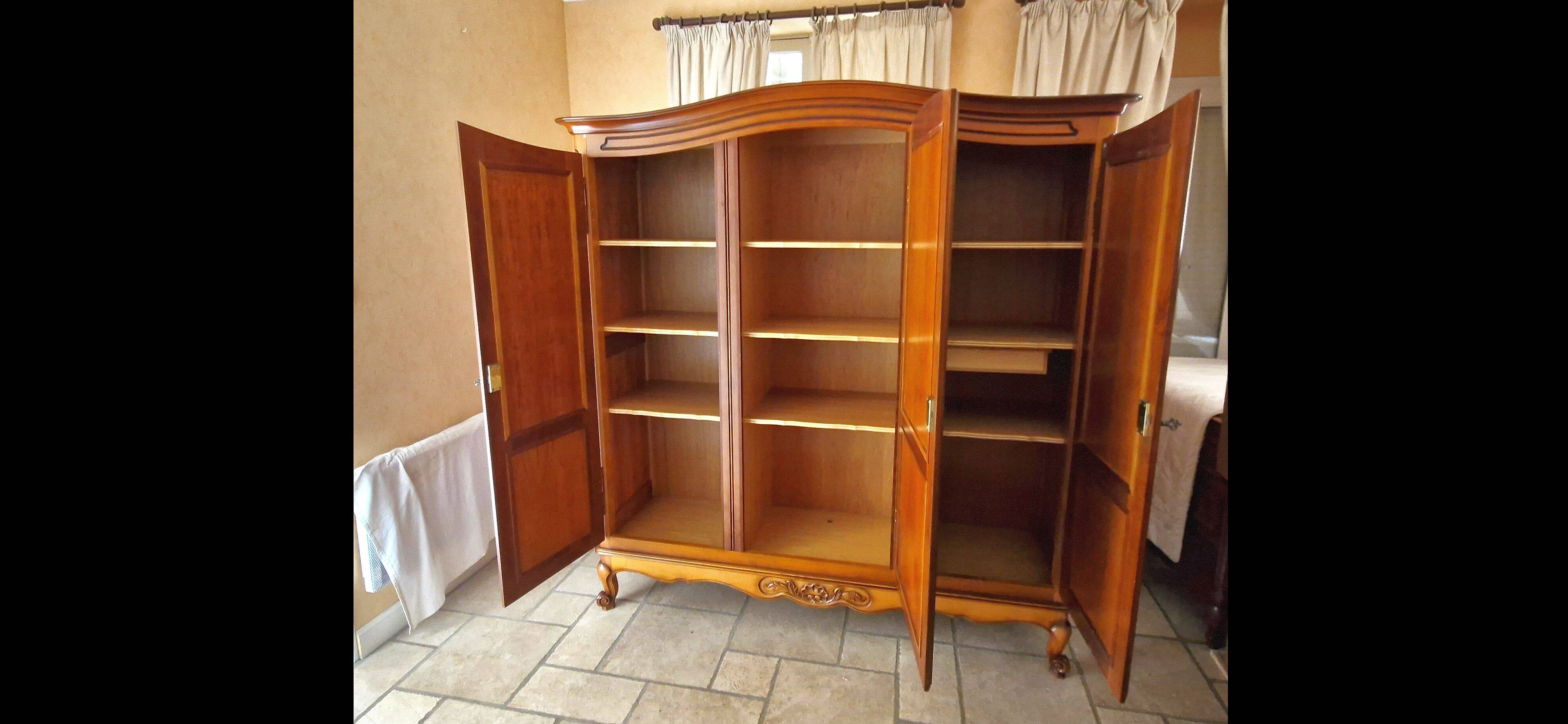 Wooden style wardrobe, 3 doors and 9 internal shelves.