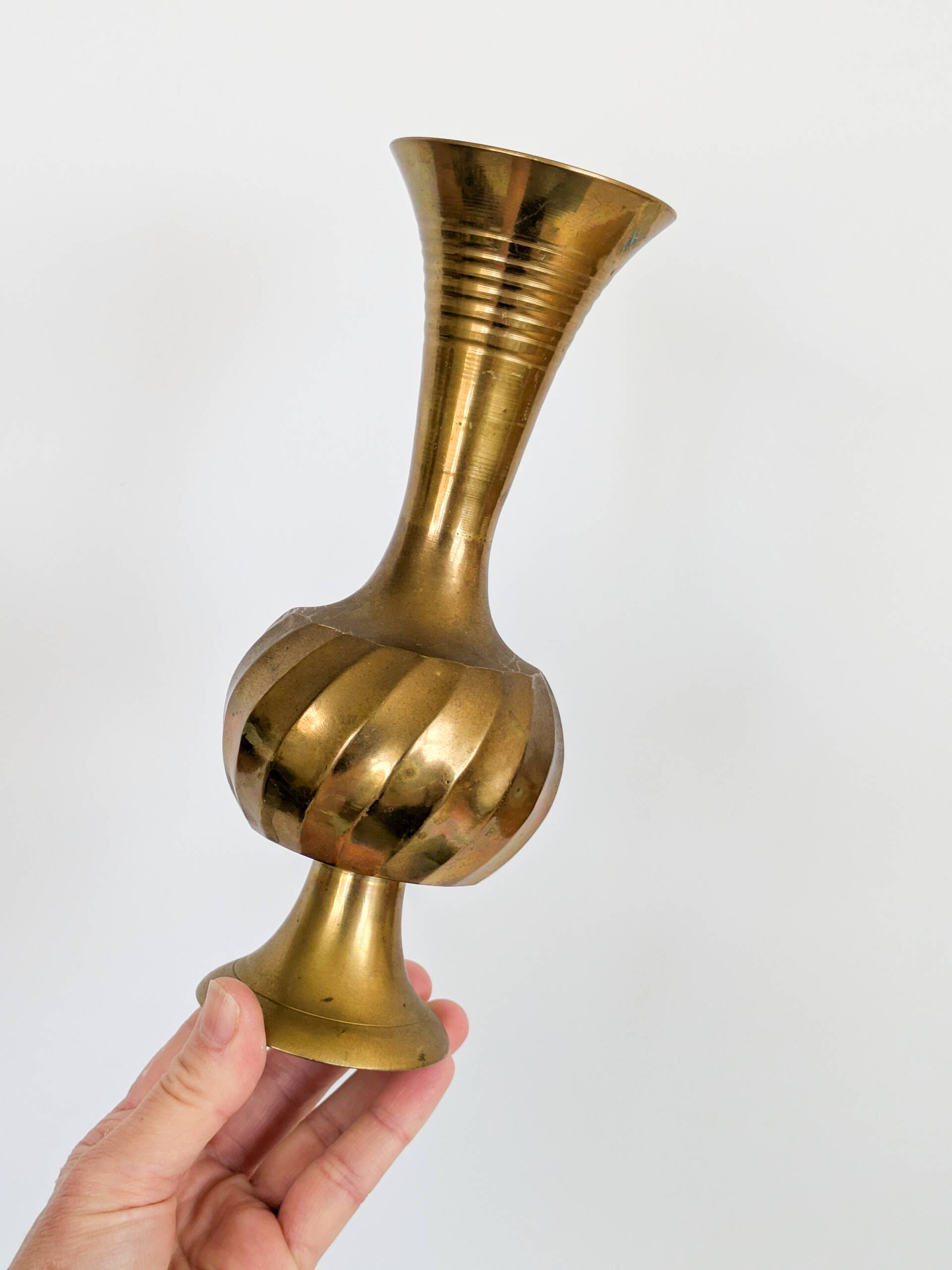 Solid brass Midcentury vase in trumpet shape with twisted details.