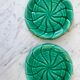 Duo of green slip bottle coasters signed marjac bauzil 50s