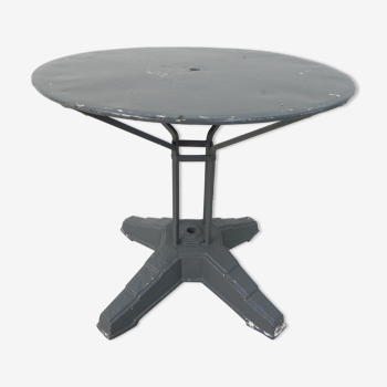 Steel garden table on cast iron base