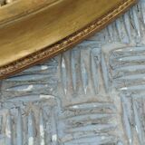 Antique oval mirror in gilded stucco with gold leaf, 19th century