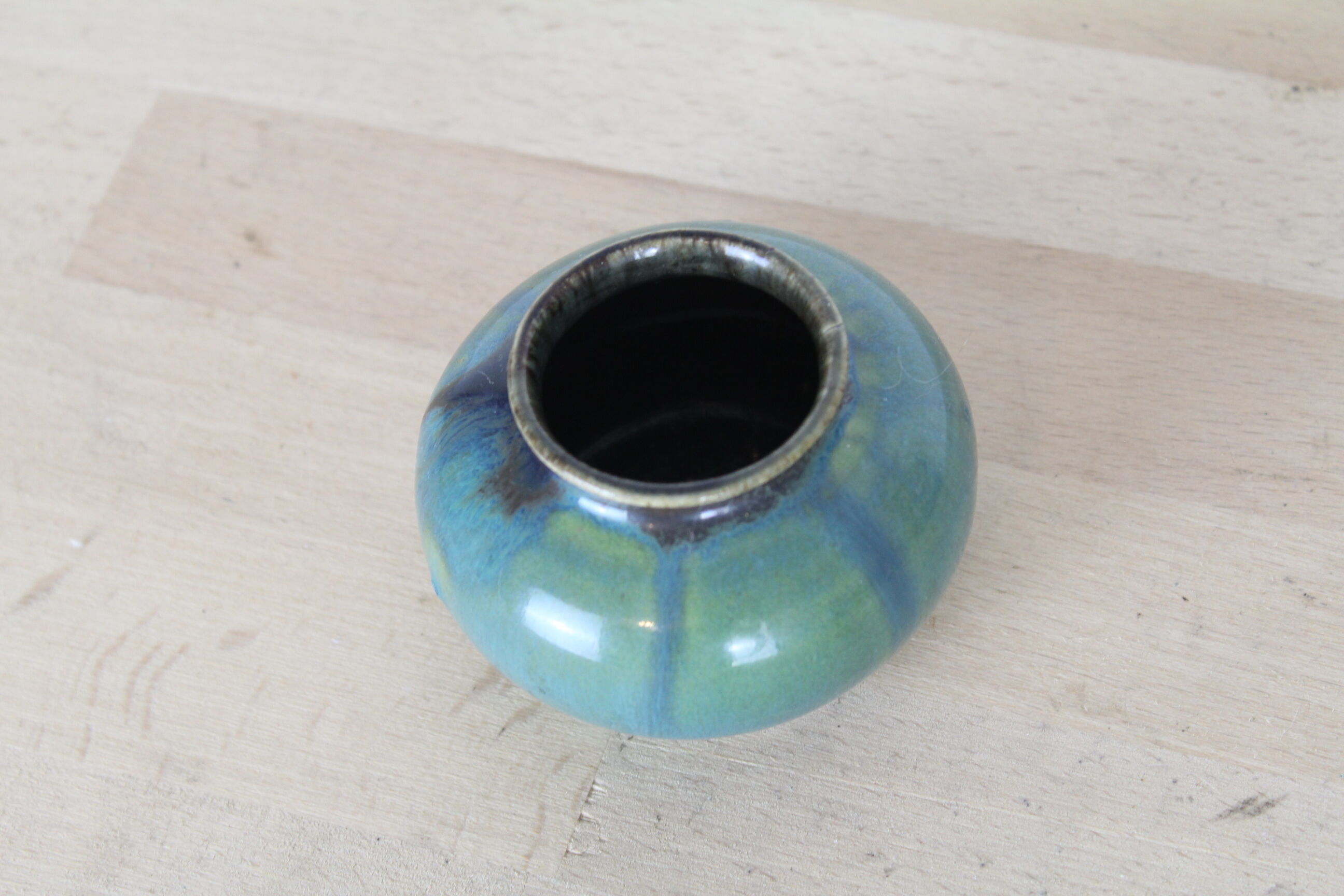 Ball vase with blue drippings