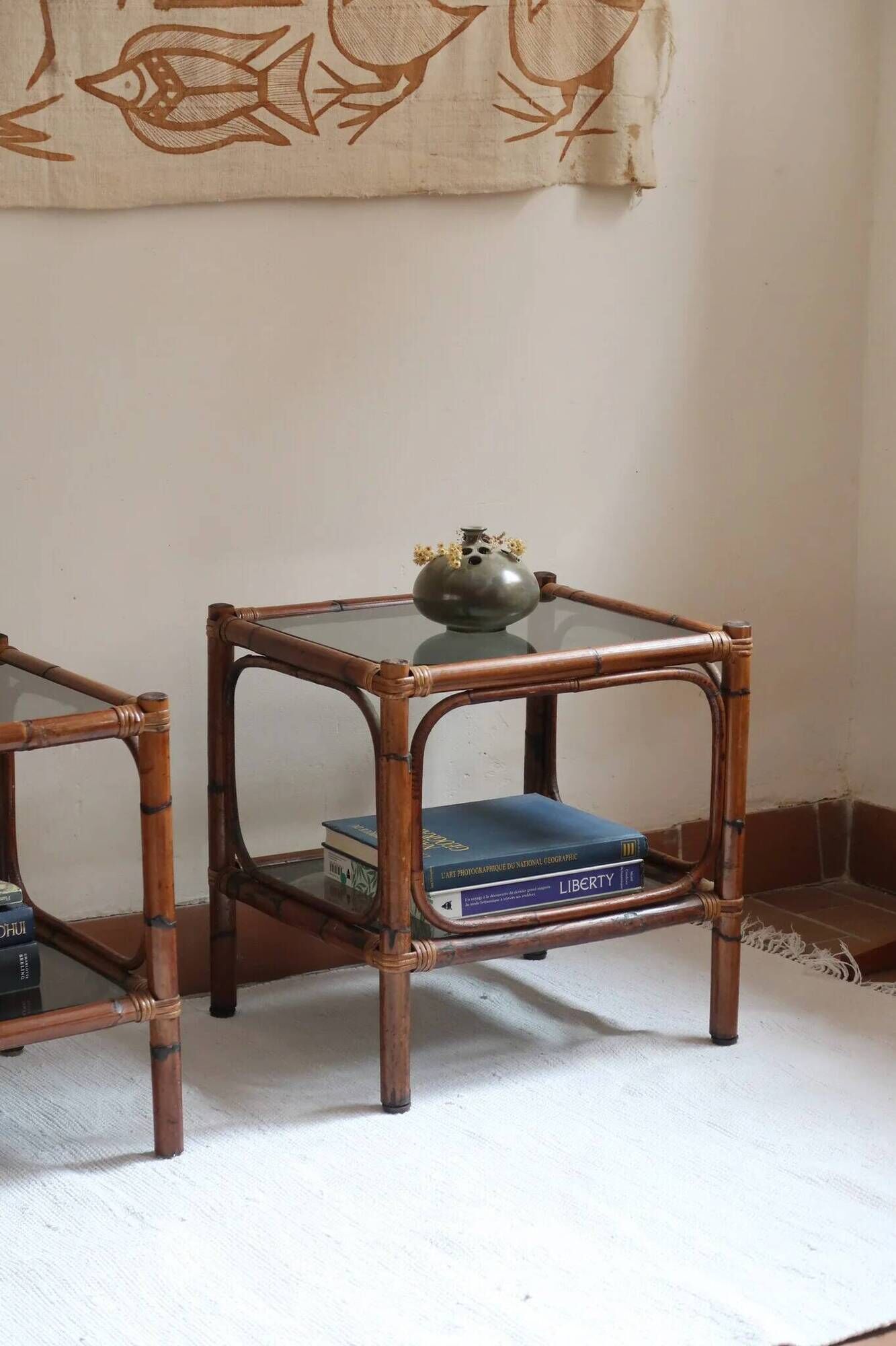Pair of bamboo and rattan bedside tables, smoked glass tops.