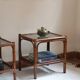 Pair of bamboo and rattan bedside tables, smoked glass tops.