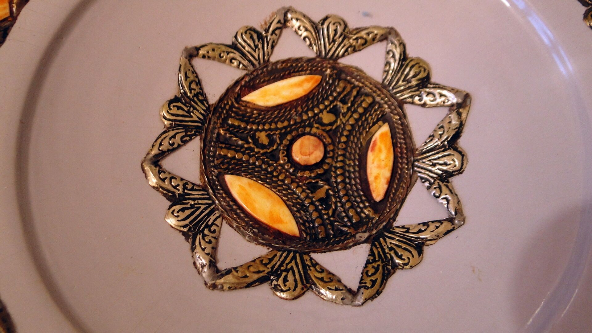 Hollow glazed terracotta dish with oriental decor to hang