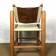 Wooden and leather chair with swivel back