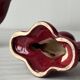 Pair of 1950s burgundy earthenware candlesticks