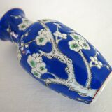 Old blue vase with vintage porcelain cherry blossoms