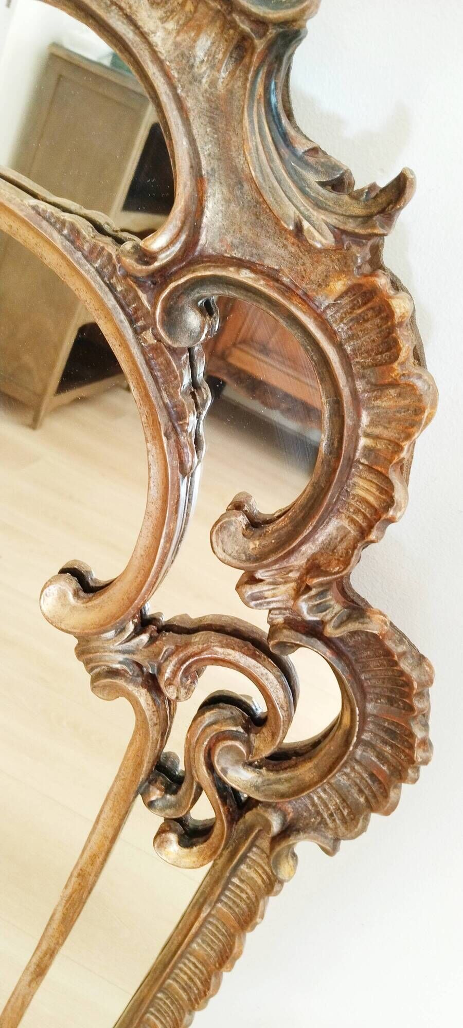 Antique mirror with rococo-style pareclose, in gilded wood, 19th century