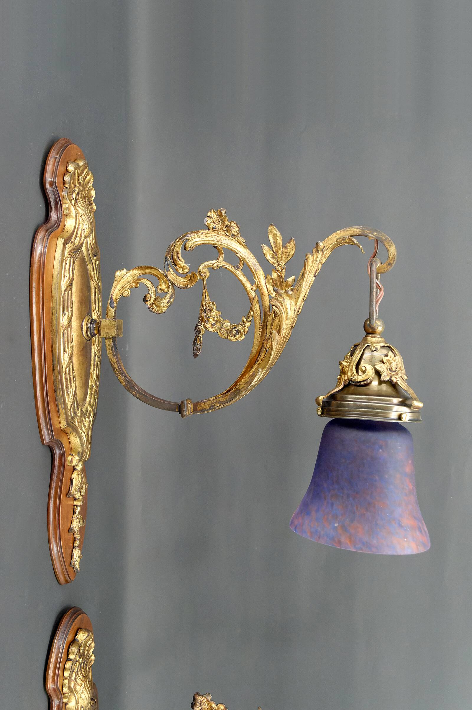 Pair of Rococo / Louis XV wall lights in gilded bronze, walnut bases and glass tulips, France, Circ