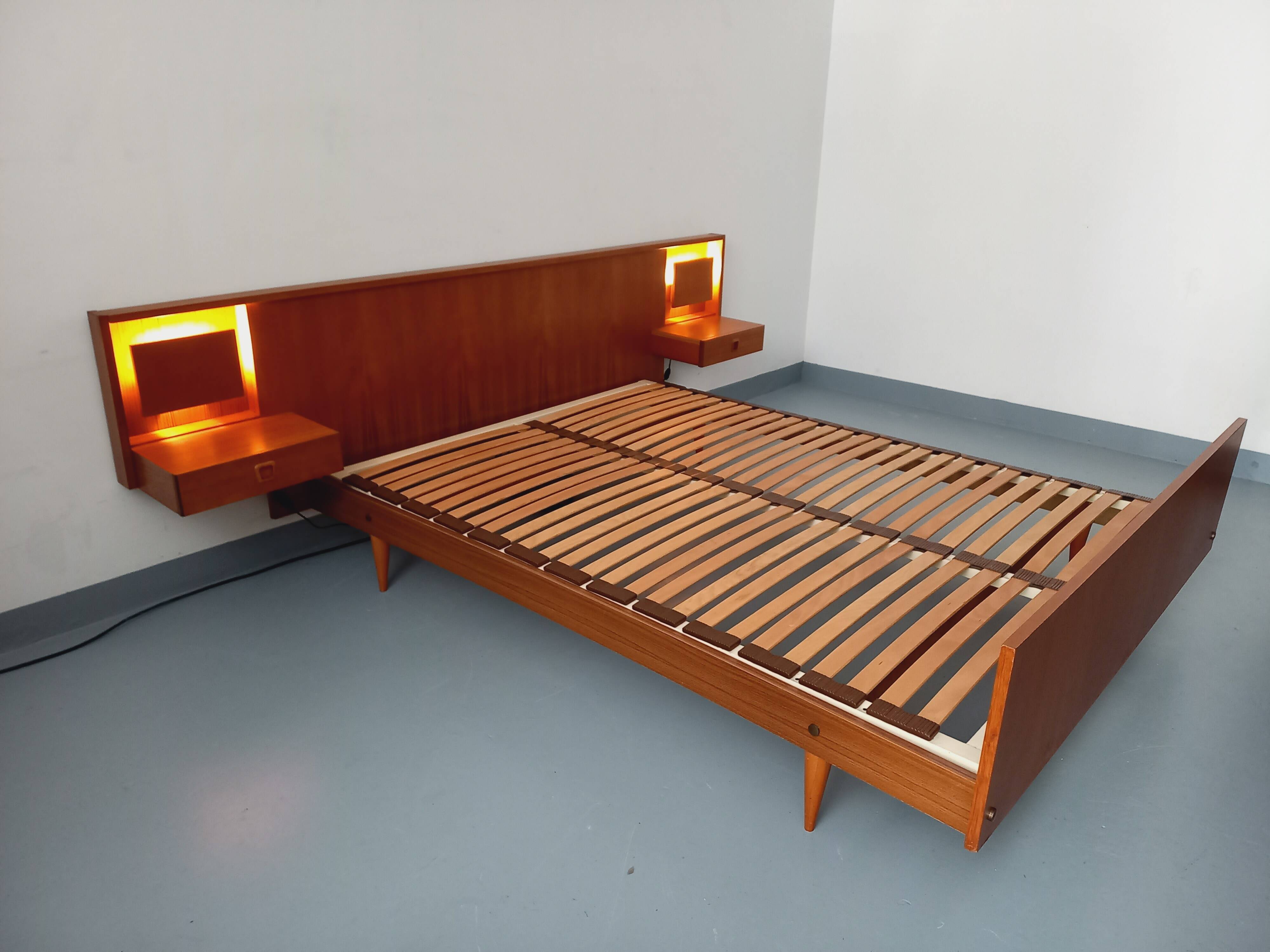 Double bed in vintage Scandinavian style from the 1960s with bedside tables in teak.
