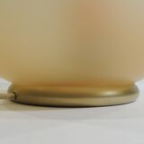 Vintage frosted glass lamp, round globe, elegant design, soft light.