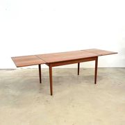 Teak dining table with integrated extensions — Scandinavian