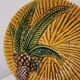 Assiette en barbotine Vallauris A.M. décor palmier