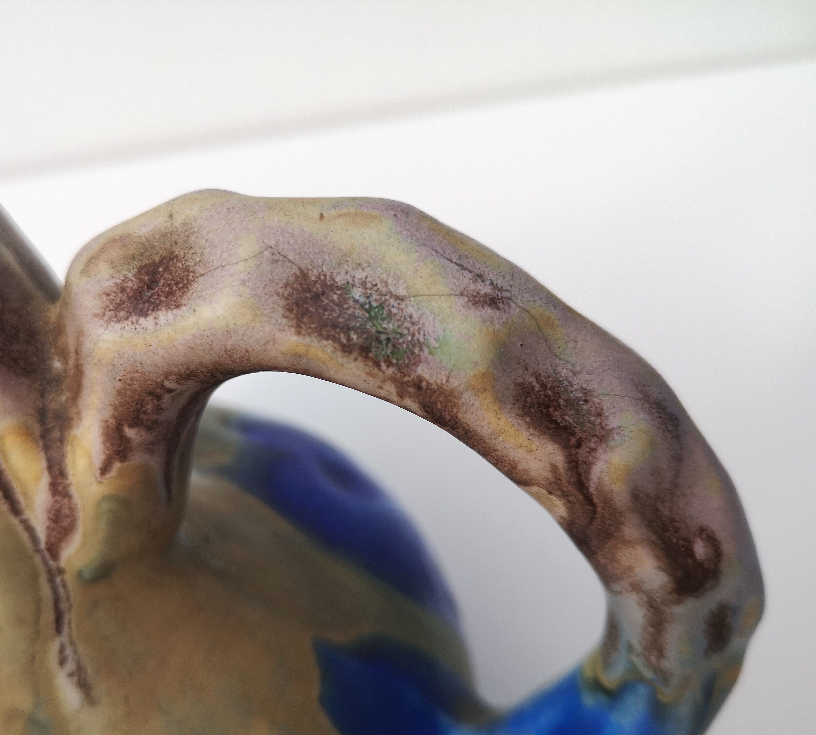 Vintage decanter in enamelled earthenware