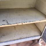 Small white and speckled gray industrial style enameled piece of furniture