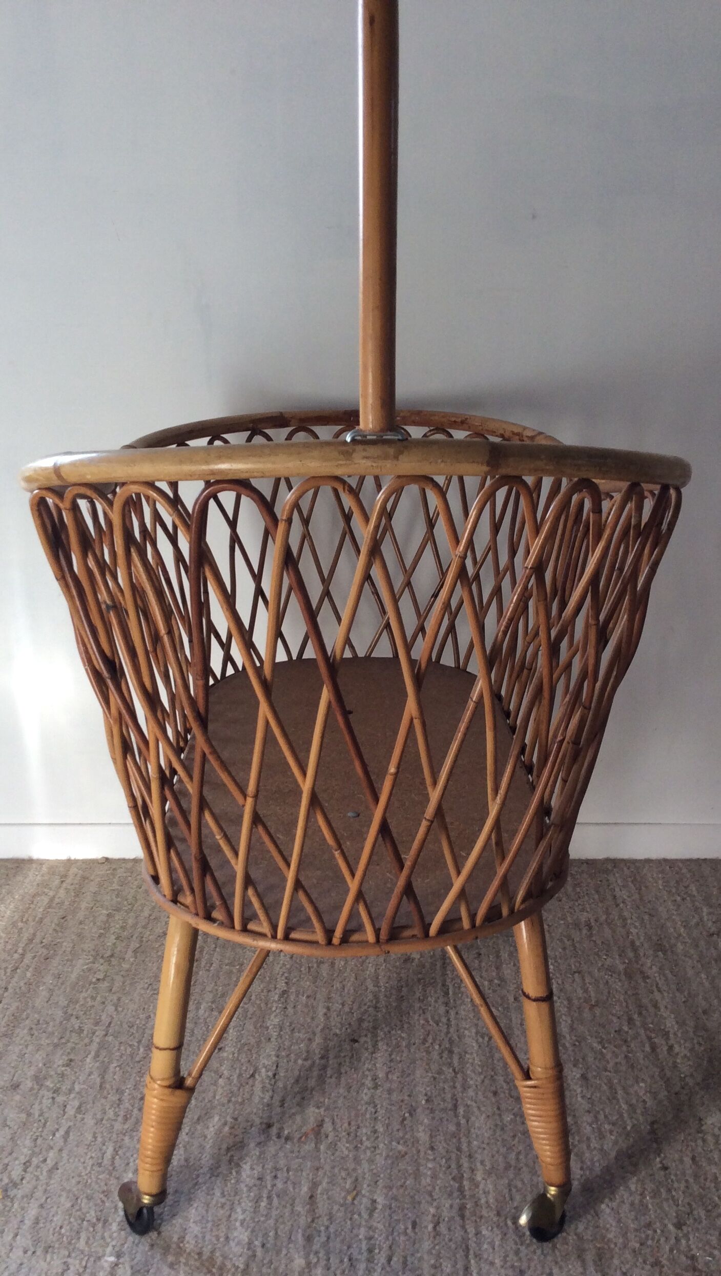 Vintage rattan cradle with its spire
