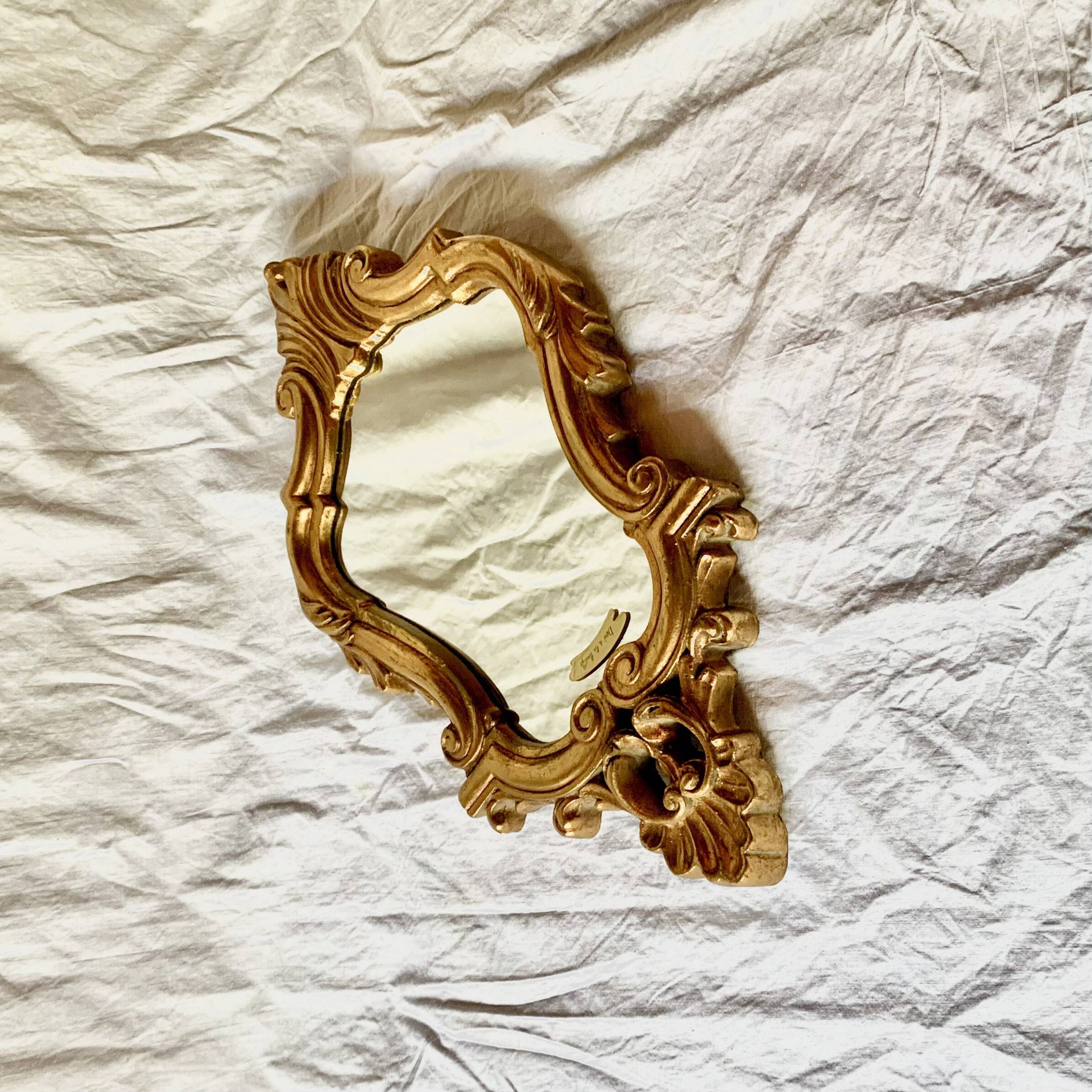 Antique wall mirror in gold leaf resin