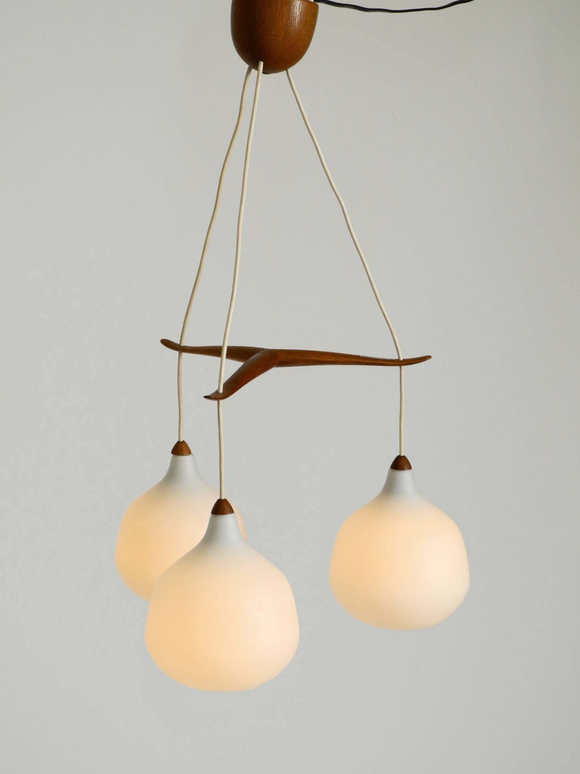 Pendant lamp with opal glass shades teak frame by Uno & Östen Kristiansson