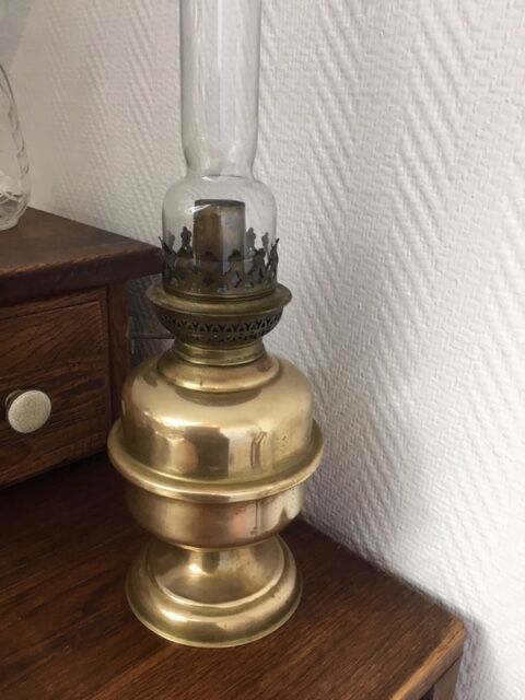 Old-fashioned brass standing oil lamp
