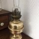 Old-fashioned brass standing oil lamp