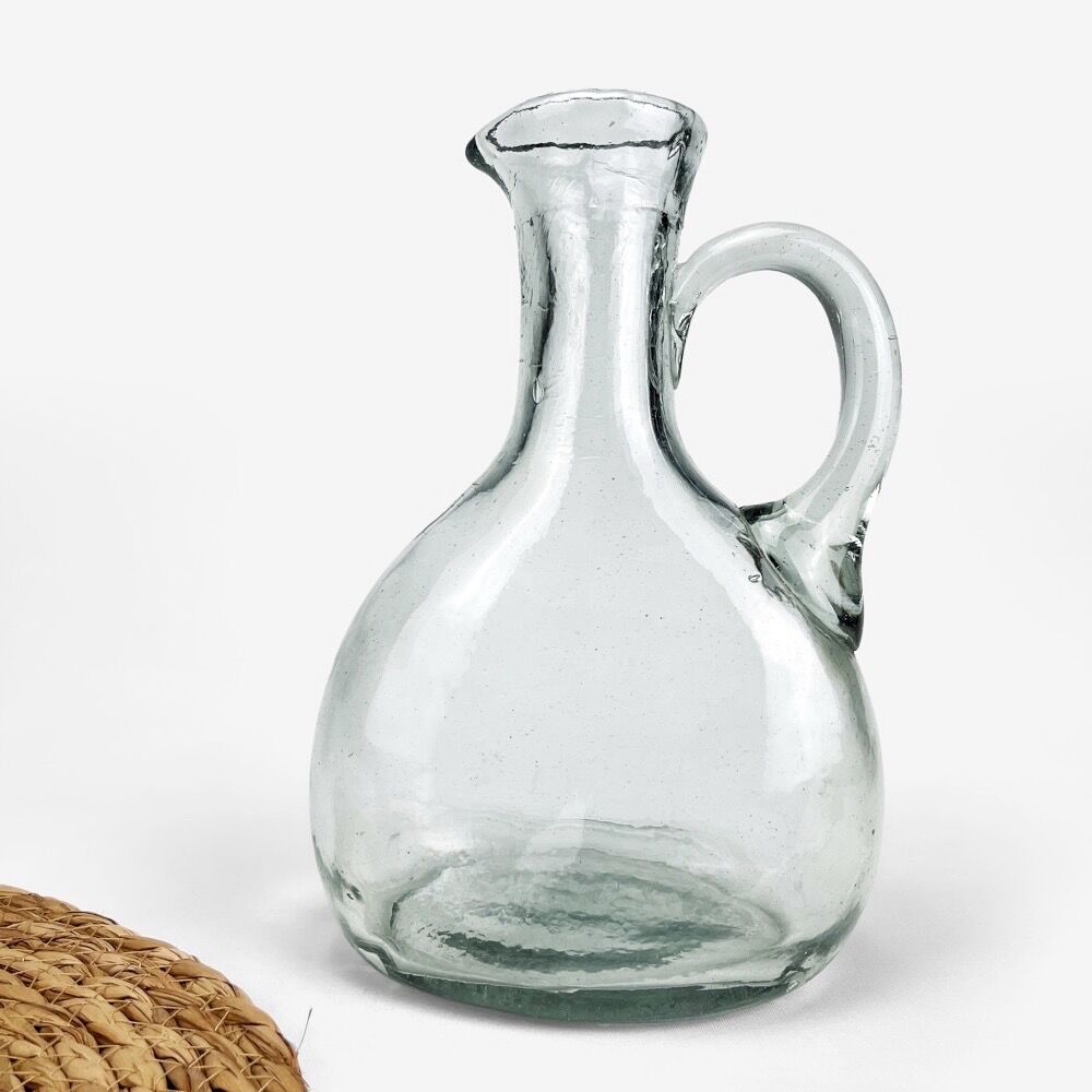 Antique water jug made of thick blown glass
