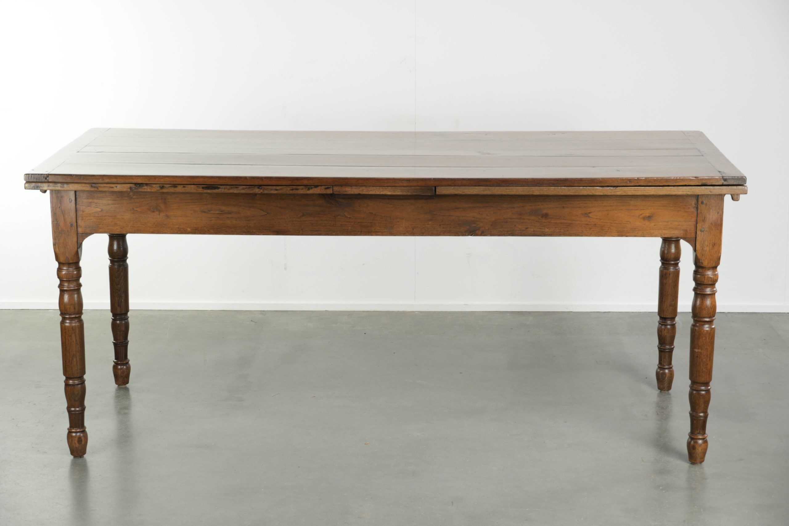 Antique oak dining table from the late 18th century with extendable leaves