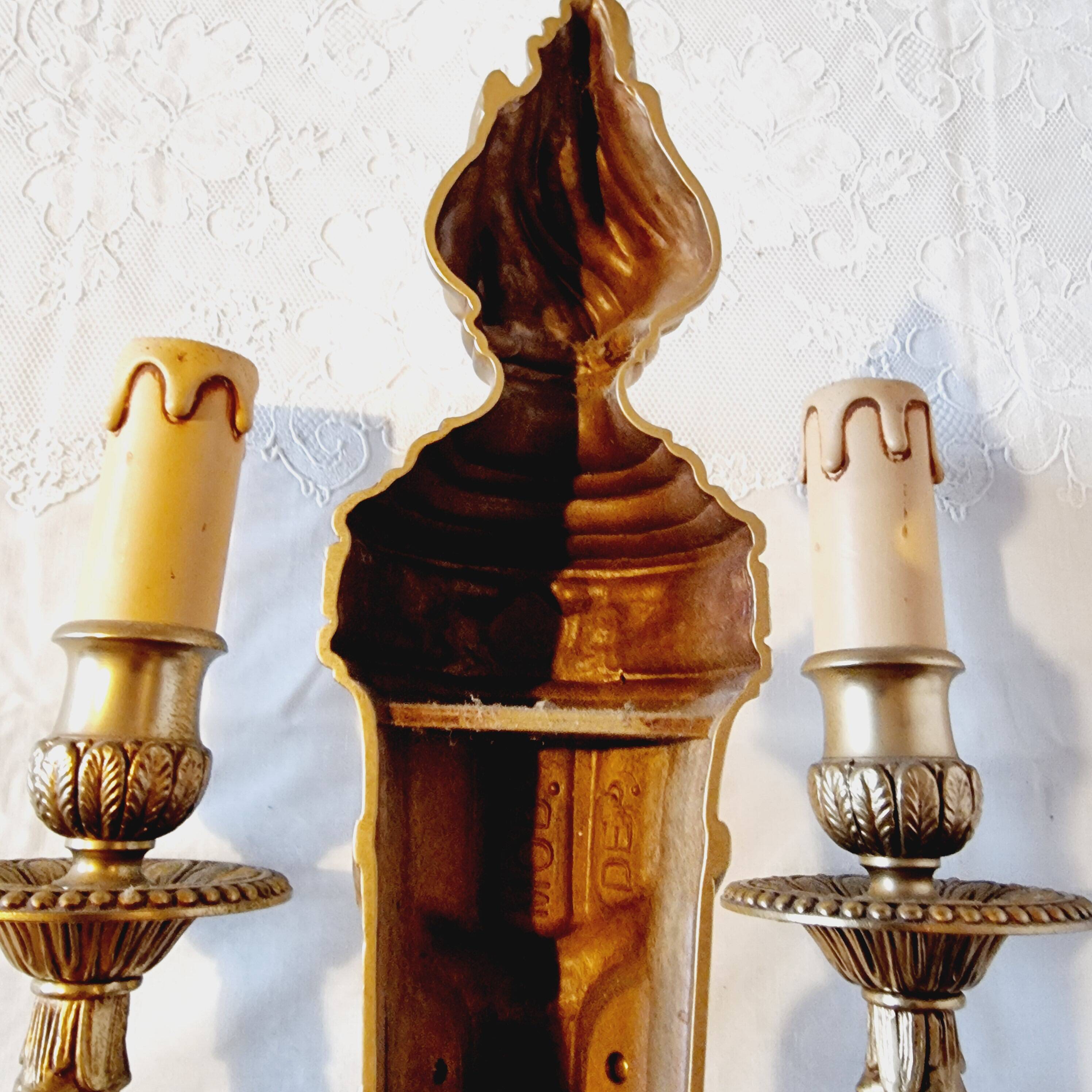 Pair of Louis XV style rocaille two-armed sconces in gilded bronze