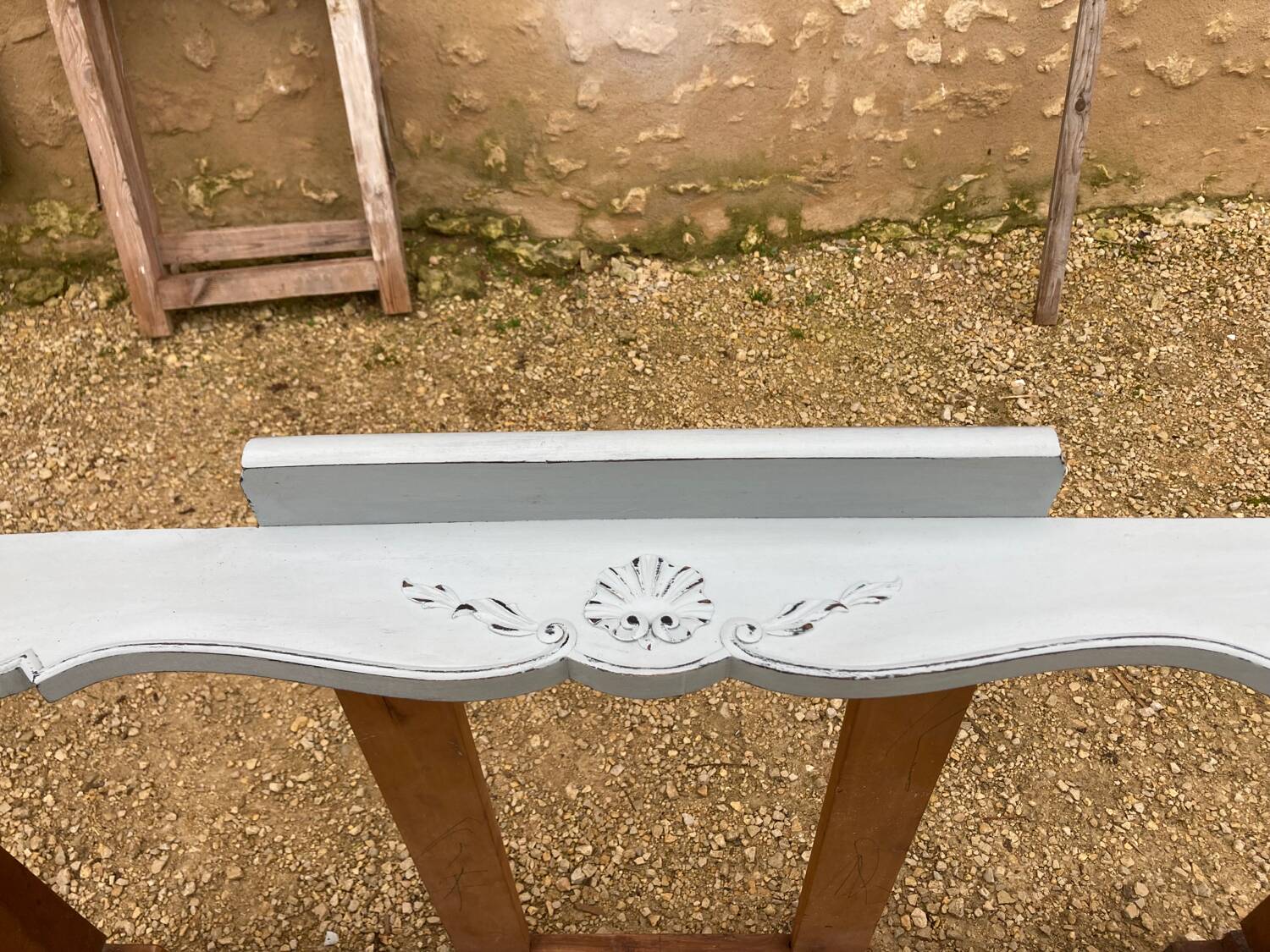 Louis XV style walnut table with a natural wood top.