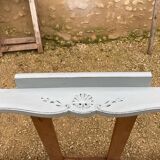 Louis XV style walnut table with a natural wood top.