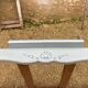 Louis XV style walnut table with a natural wood top.