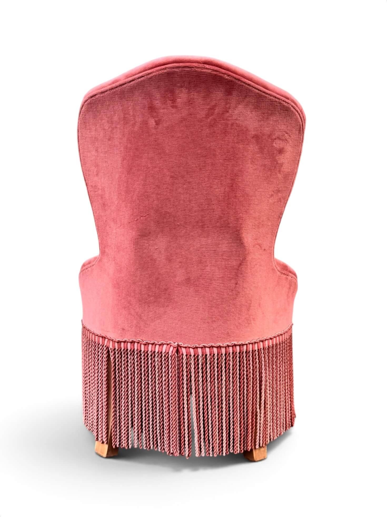 Vintage pink velvet fringed armchair