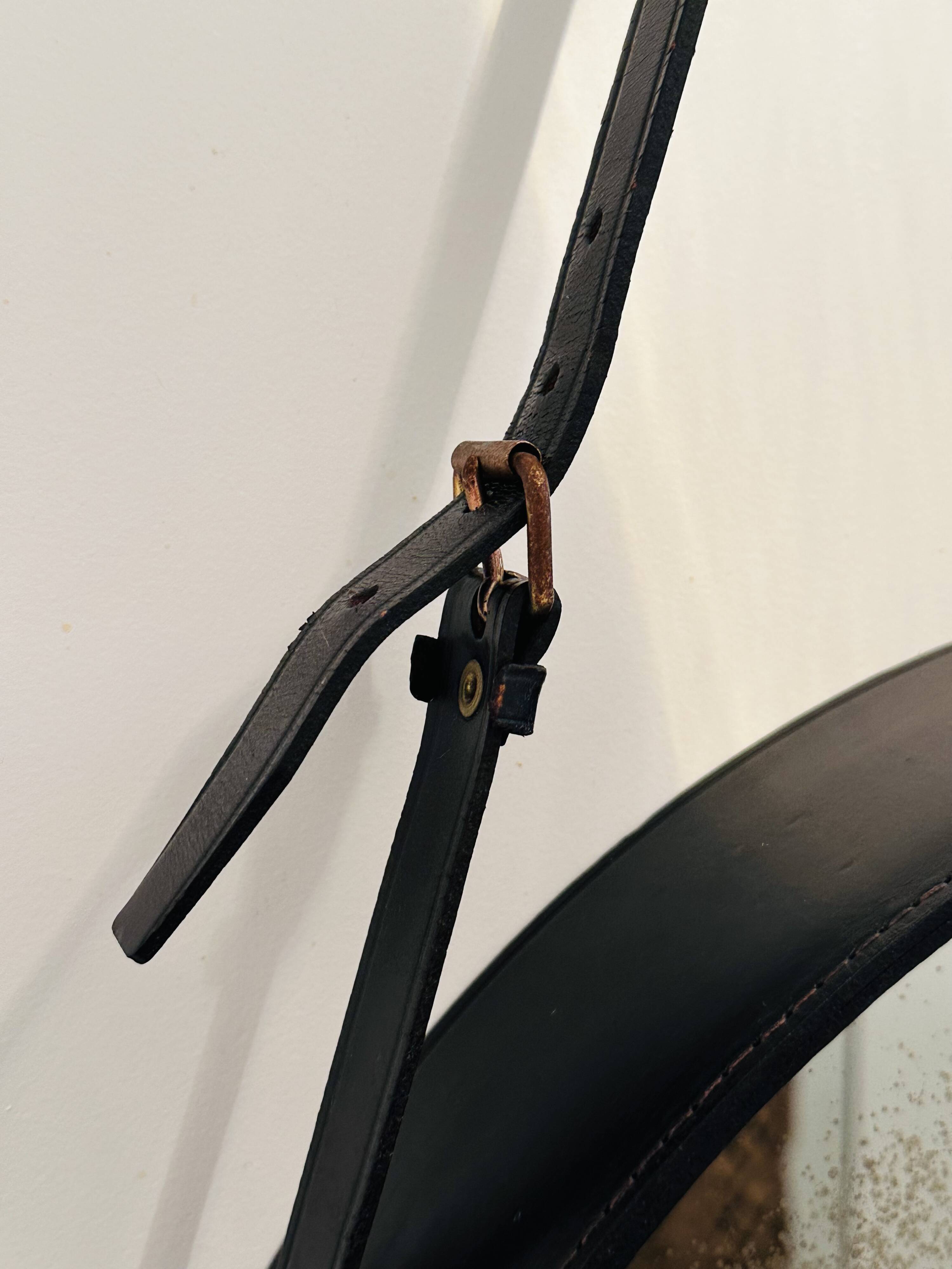 Jacques Adnet pair of circular leather and brass mirrors