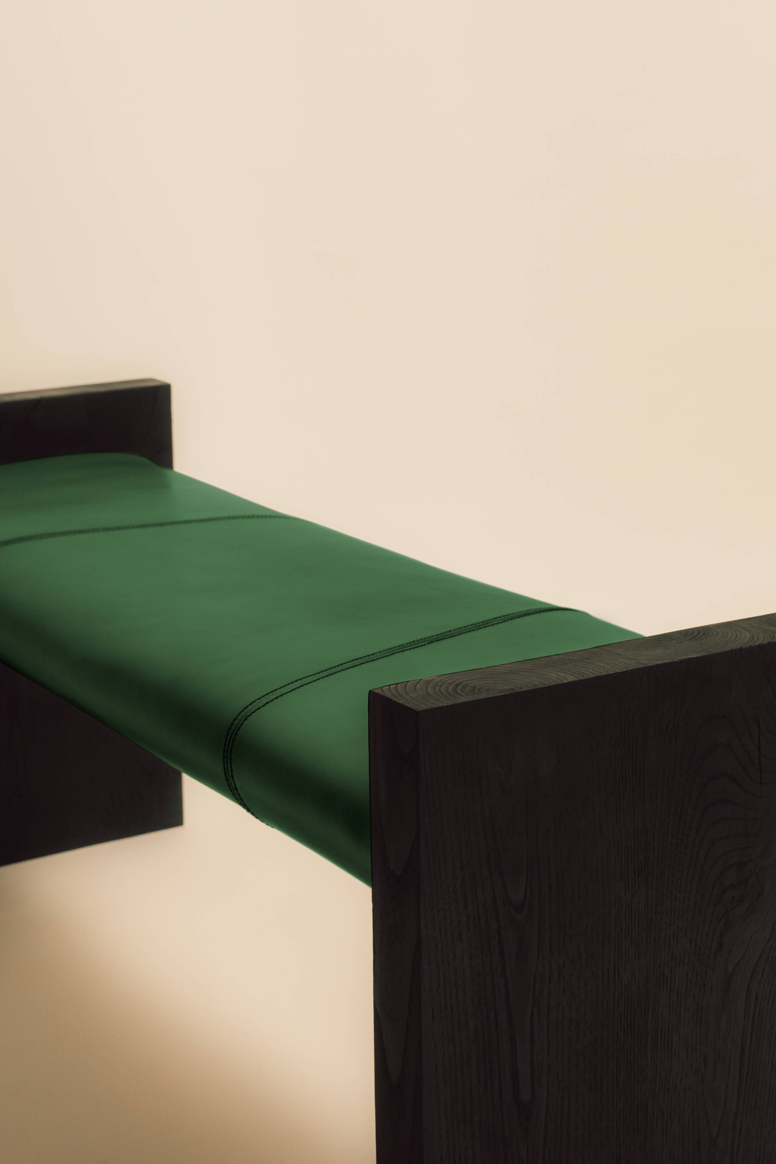 Maërl bench, sepia model, ebonized chestnut and green leather