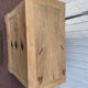 Raw wood chest of drawers with three drawers and shell handles.