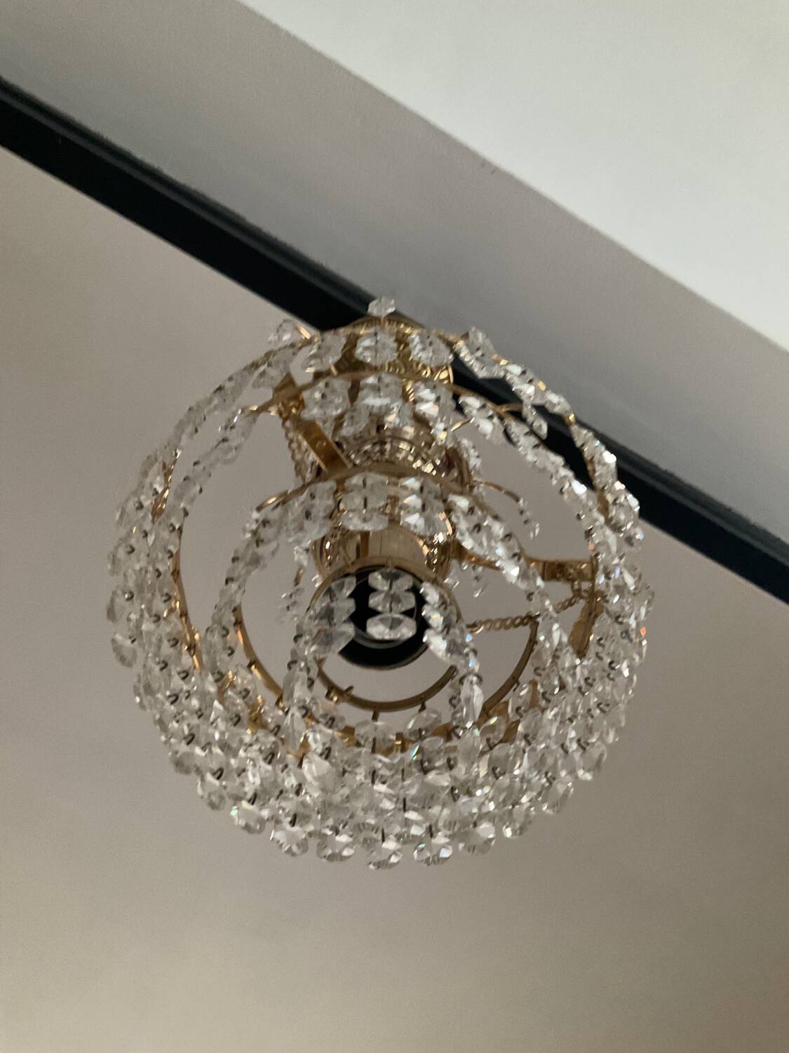 Cascade chandelier with crystal and brass tassels