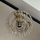 Cascade chandelier with crystal and brass tassels
