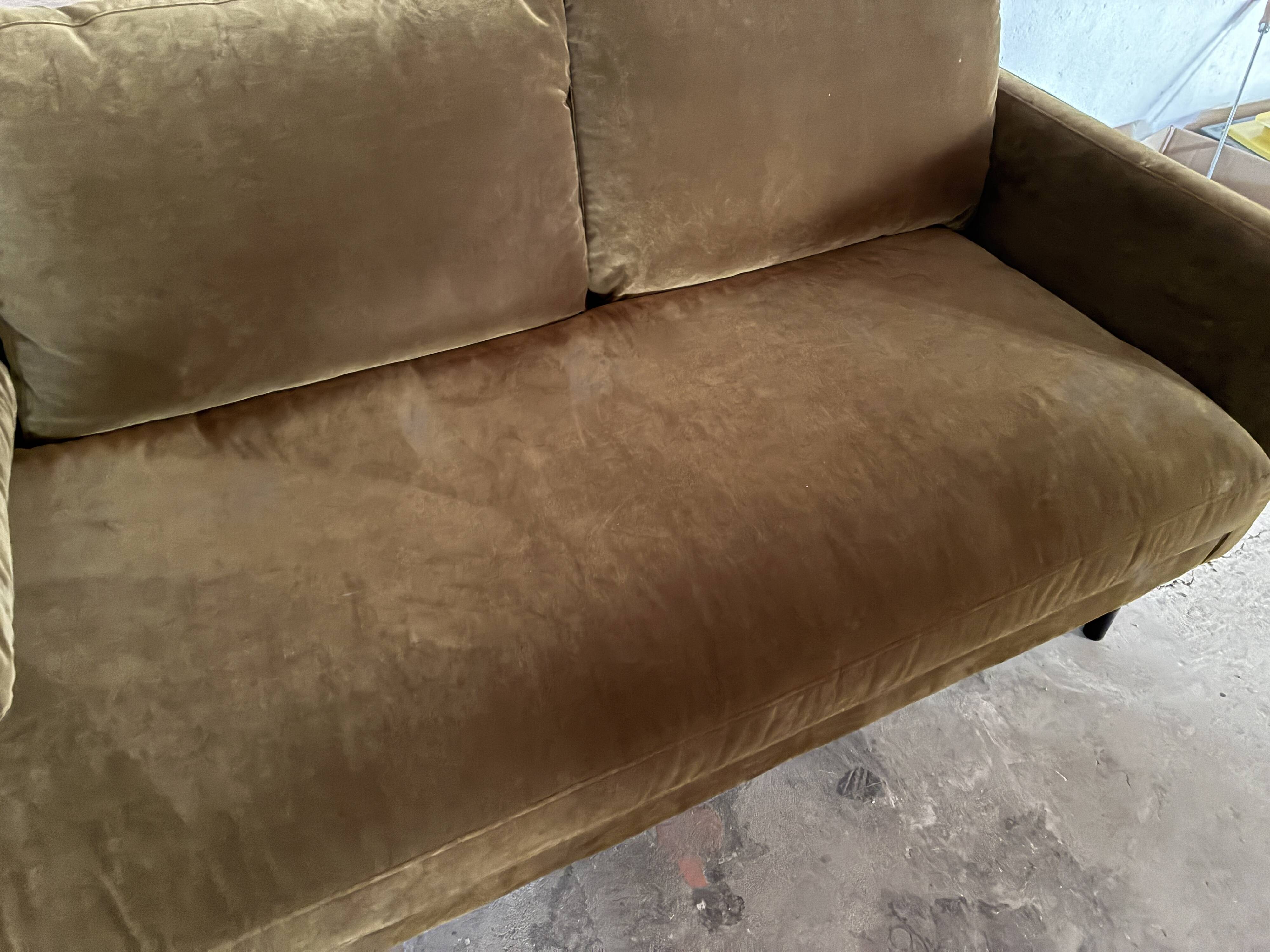 Large velvet three-seater sofa