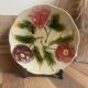 Ancienne assiette barbotine 3 fleurs art déco