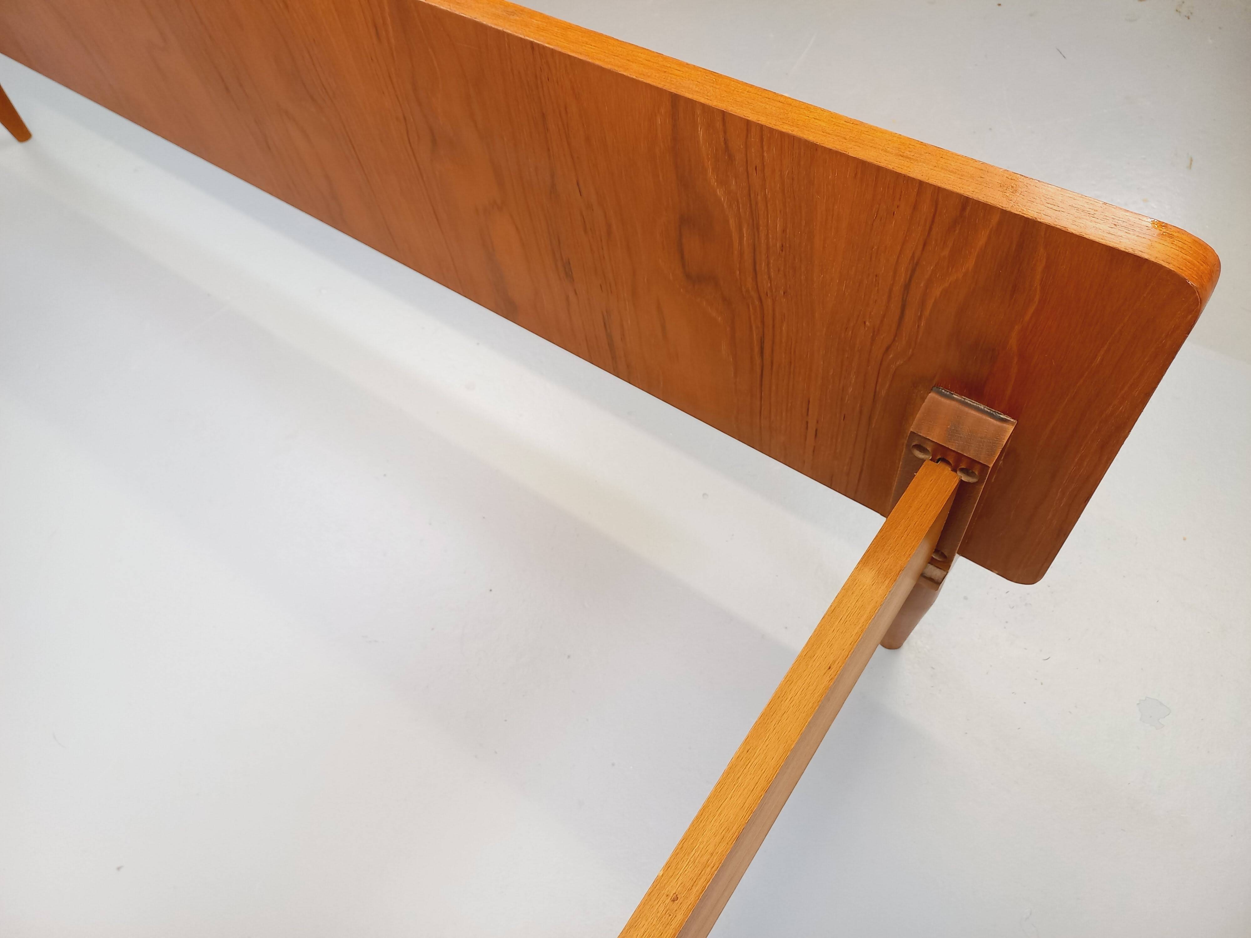 Double bed in vintage Scandinavian style from the 1960s with bedside tables.