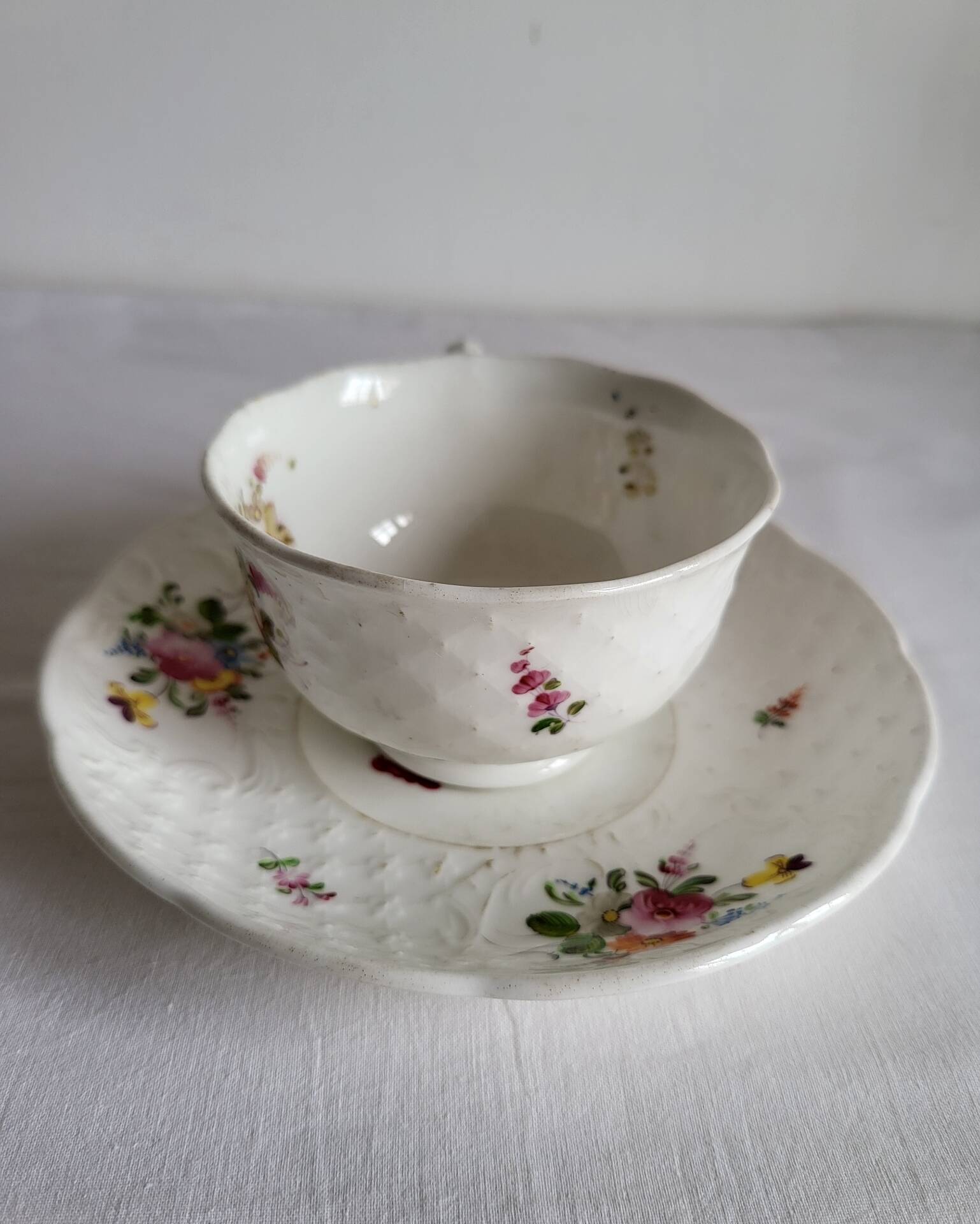 Antique Cup and Saucer in Porcelain with Hand-Painted Floral Decoration
